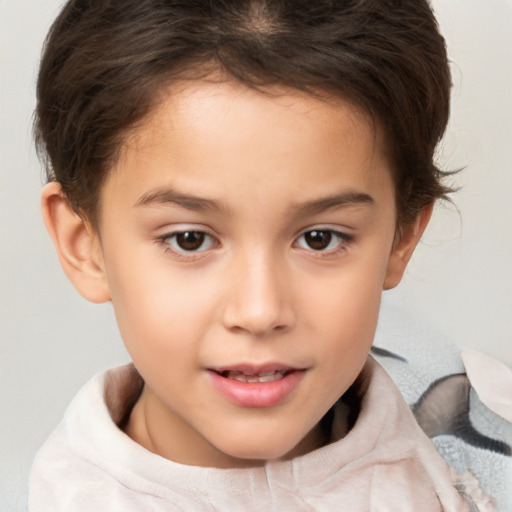 Joyful white child female with short  brown hair and brown eyes