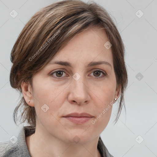 Joyful white adult female with medium  brown hair and grey eyes