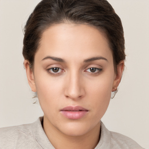 Neutral white young-adult female with short  brown hair and brown eyes