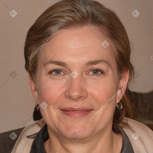 Joyful white adult female with medium  brown hair and grey eyes