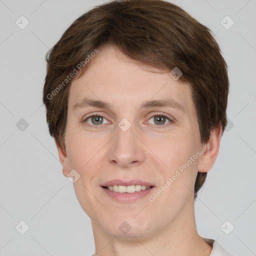 Joyful white adult male with short  brown hair and grey eyes