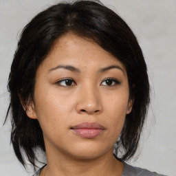 Neutral asian young-adult female with medium  brown hair and brown eyes