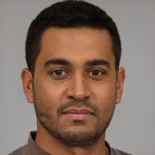 Neutral latino young-adult male with short  brown hair and brown eyes