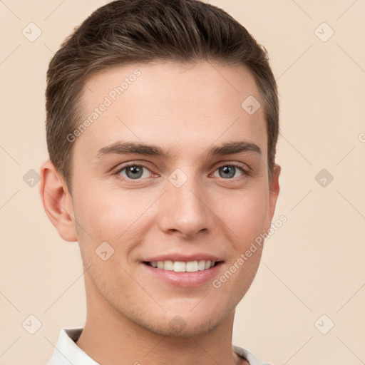 Joyful white young-adult male with short  brown hair and grey eyes