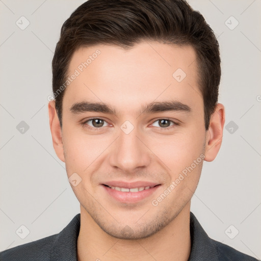 Joyful white young-adult male with short  brown hair and brown eyes