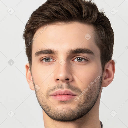 Neutral white young-adult male with short  brown hair and brown eyes