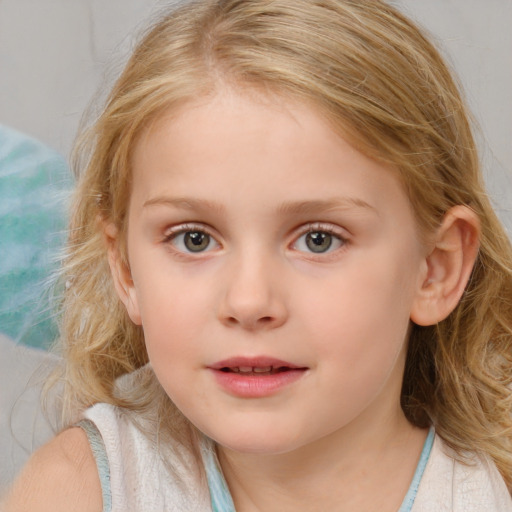 Joyful white child female with medium  brown hair and blue eyes