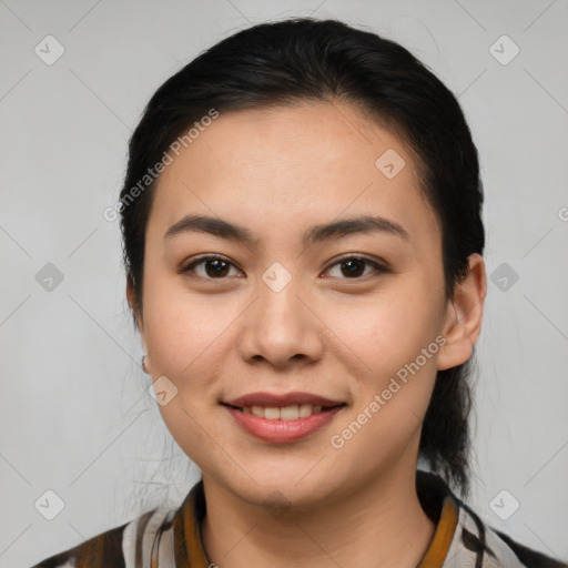 Joyful latino young-adult female with medium  brown hair and brown eyes