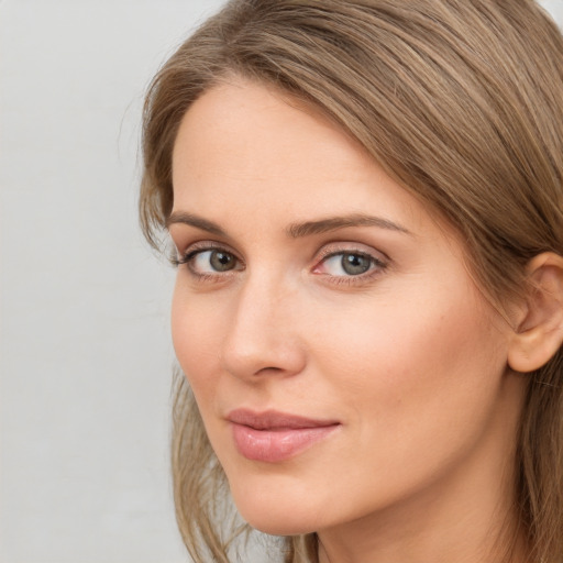 Neutral white young-adult female with long  brown hair and grey eyes