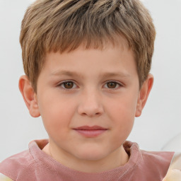 Joyful white child male with short  brown hair and brown eyes