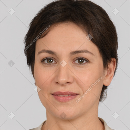 Joyful white adult female with short  brown hair and brown eyes