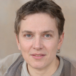 Joyful white adult male with short  brown hair and grey eyes