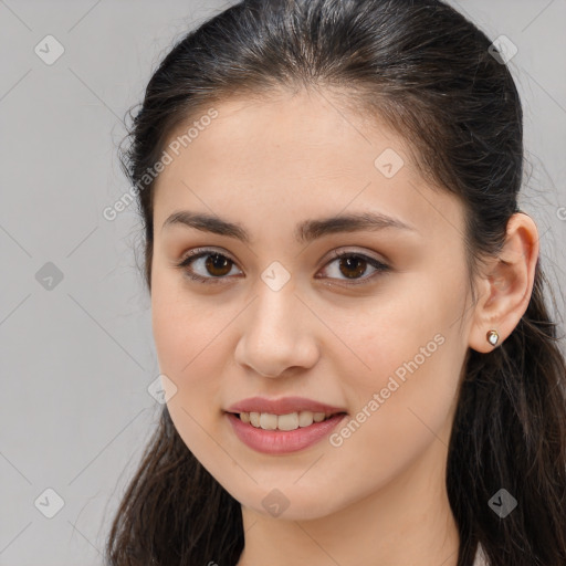 Joyful white young-adult female with long  brown hair and brown eyes