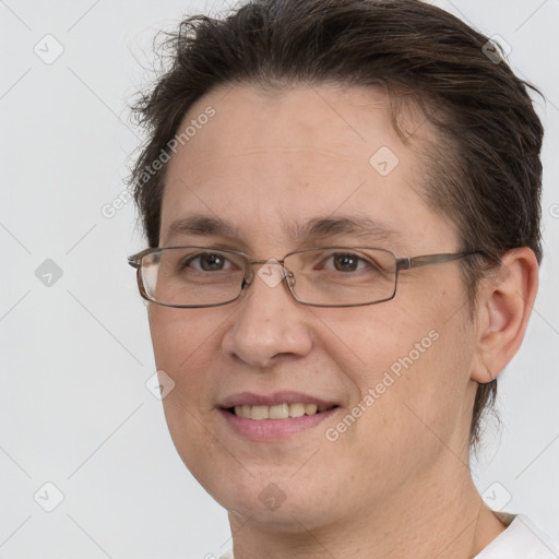 Joyful white adult female with short  brown hair and brown eyes