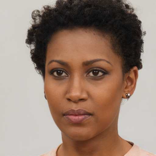 Neutral black young-adult female with short  brown hair and brown eyes