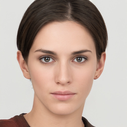 Neutral white young-adult female with short  brown hair and brown eyes