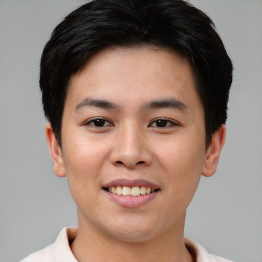 Joyful asian young-adult female with short  brown hair and brown eyes