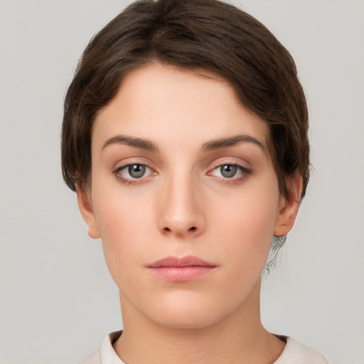 Neutral white young-adult female with short  brown hair and brown eyes