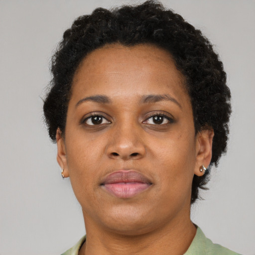 Neutral black young-adult female with short  brown hair and brown eyes