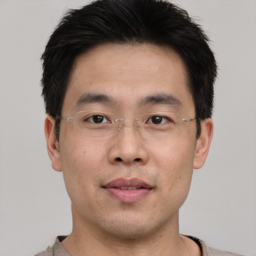 Neutral asian young-adult male with short  brown hair and brown eyes