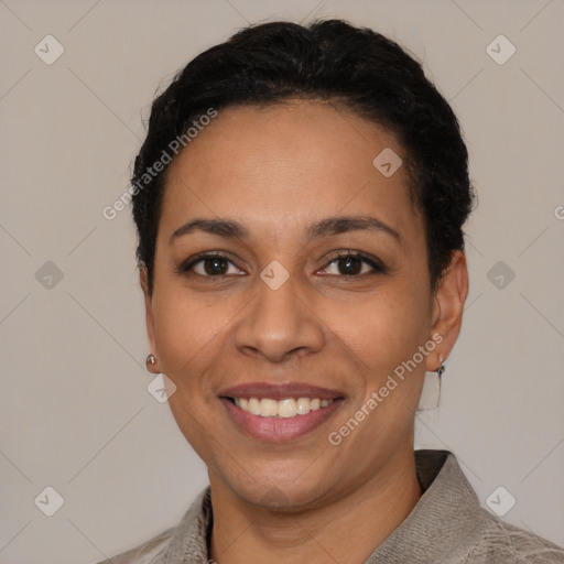 Joyful latino young-adult female with short  black hair and brown eyes