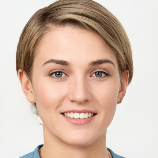 Joyful white young-adult female with medium  brown hair and grey eyes