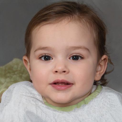 Joyful white child female with short  brown hair and blue eyes