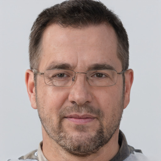 Joyful white adult male with short  brown hair and brown eyes