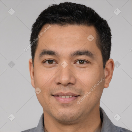 Joyful white young-adult male with short  black hair and brown eyes