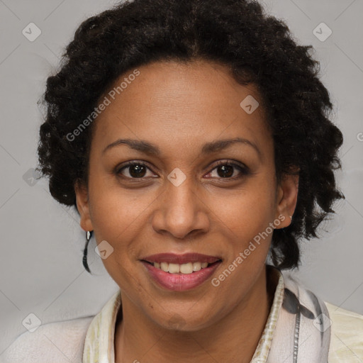 Joyful black adult female with short  brown hair and brown eyes