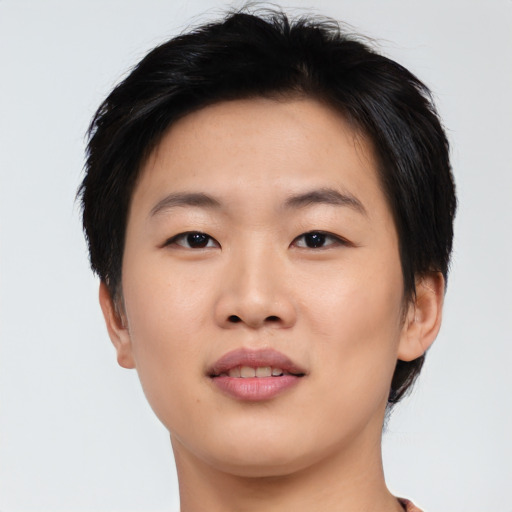 Joyful asian young-adult female with short  brown hair and brown eyes