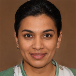 Joyful latino young-adult female with short  brown hair and brown eyes