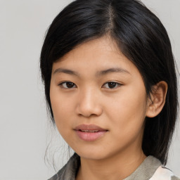 Joyful asian young-adult female with medium  black hair and brown eyes