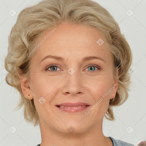 Joyful white adult female with medium  brown hair and blue eyes