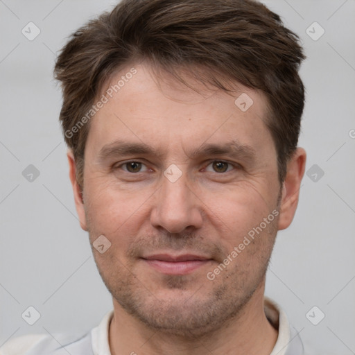 Joyful white adult male with short  brown hair and grey eyes