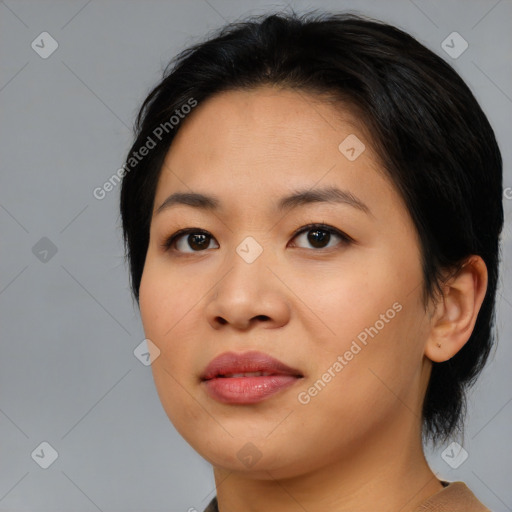 Joyful asian young-adult female with medium  black hair and brown eyes