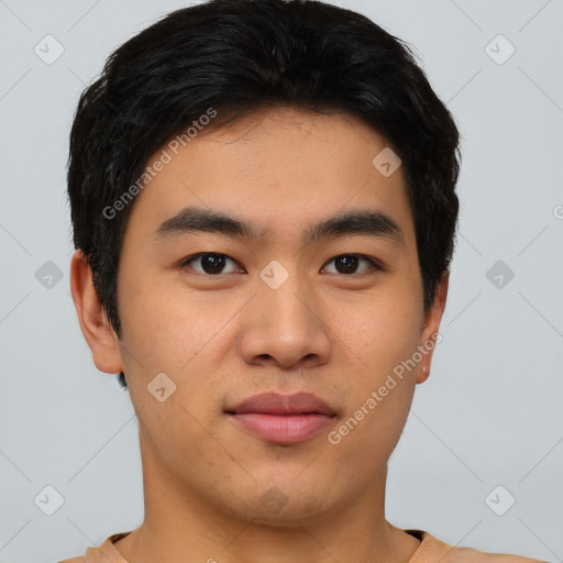 Joyful asian young-adult male with short  black hair and brown eyes