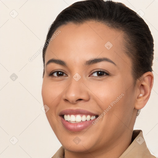 Joyful white young-adult female with short  brown hair and brown eyes