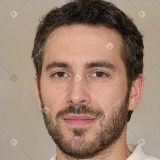 Joyful white adult male with short  brown hair and brown eyes