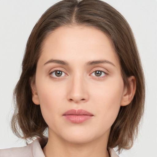 Neutral white young-adult female with medium  brown hair and brown eyes