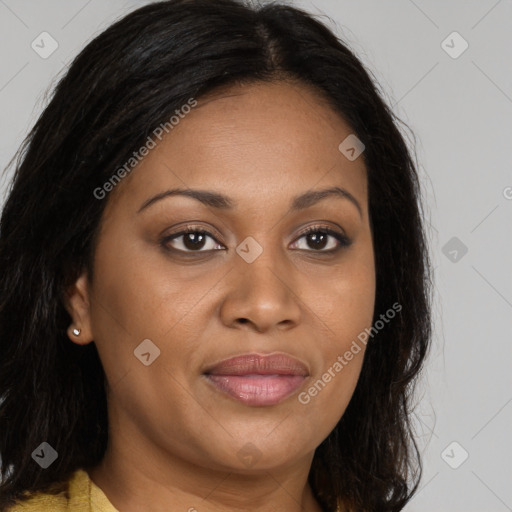 Joyful black adult female with long  brown hair and brown eyes