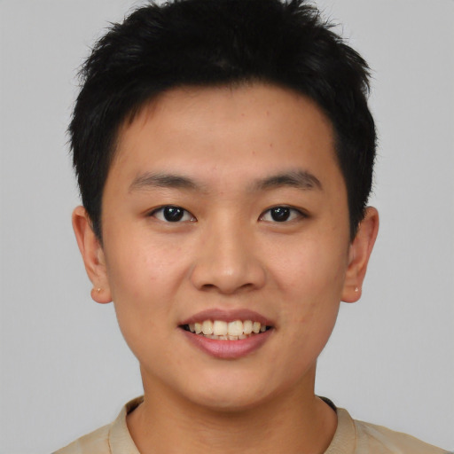 Joyful asian young-adult male with short  black hair and brown eyes