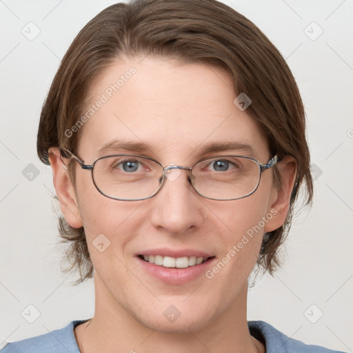 Joyful white adult female with medium  brown hair and grey eyes