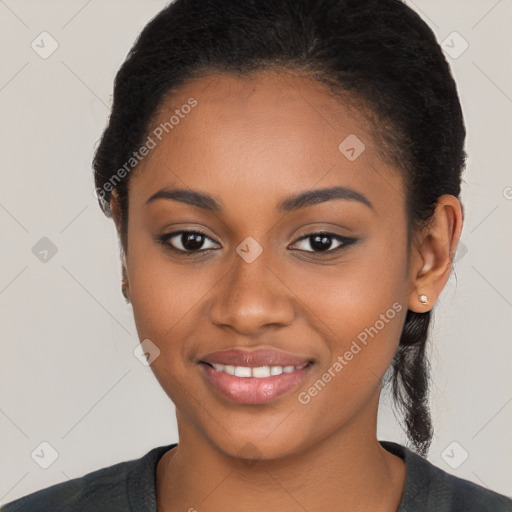 Joyful black young-adult female with long  black hair and brown eyes