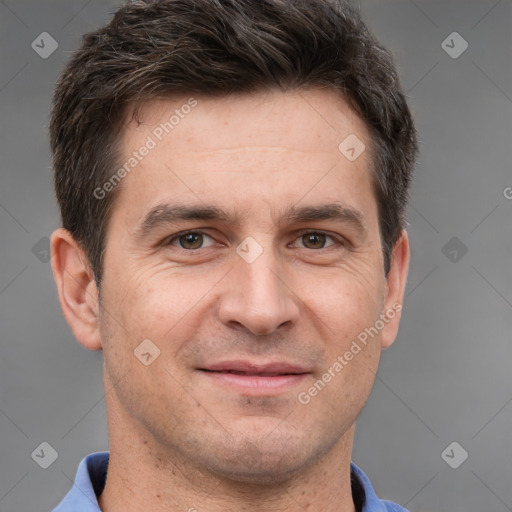 Joyful white adult male with short  brown hair and brown eyes