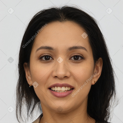 Joyful latino young-adult female with medium  brown hair and brown eyes