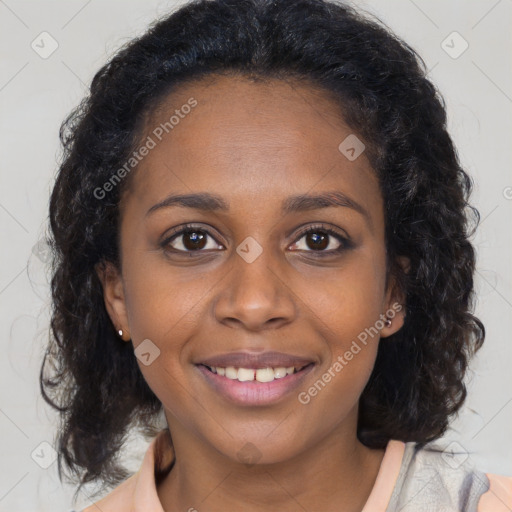 Joyful black young-adult female with long  brown hair and brown eyes