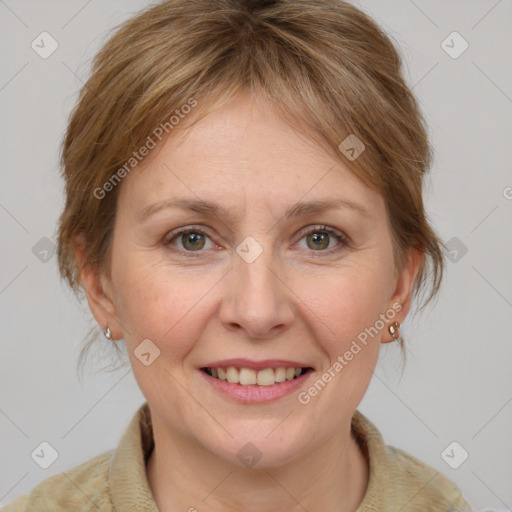 Joyful white adult female with medium  brown hair and grey eyes