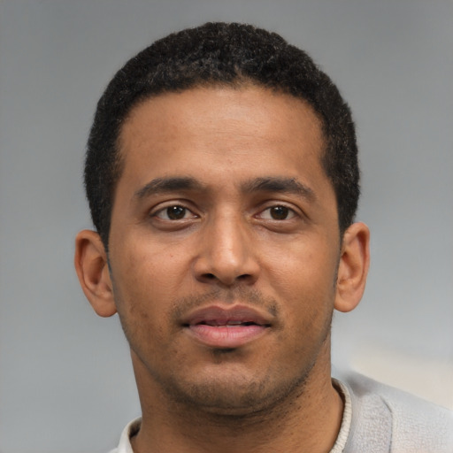 Neutral black young-adult male with short  black hair and brown eyes