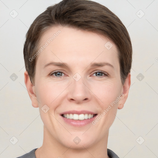 Joyful white young-adult female with short  brown hair and grey eyes